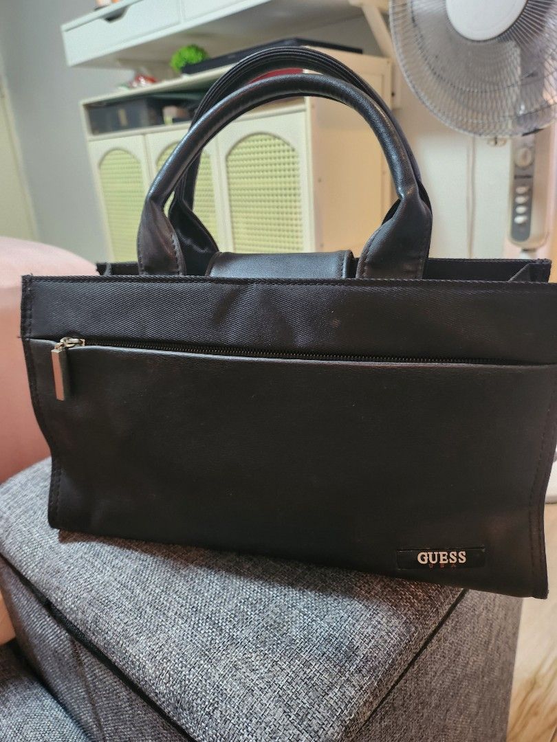 Guess Black small Tote Bag (Category: Tote Bags) located in Las Pinas. Submitted by prettychat (Listing ID 1405079736, Image 1). Description: - original small Black Guess tote bag - Front pocket with zipper - Multiple interior compartments - Dimensions: Approximately 12x6 inches -used but not abused in good quality condition .