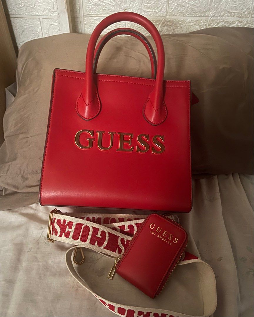 Guess Caracara Small Carryall (Category: Luxury Bags & Wallets) located in Valenzuela. Submitted by tineordonez (Listing ID 1404998495, Image 3). Description: Condition: Excellent, barely-used. Only a small, barely noticeable scratch on the leather. Color/Material: Red/Faux Leather Original Receipt/Dust Bag: Not included Used only once. GCash or bank transfer. SF shouldered by buyer. 📍Viente Reales, Valenzuela City.