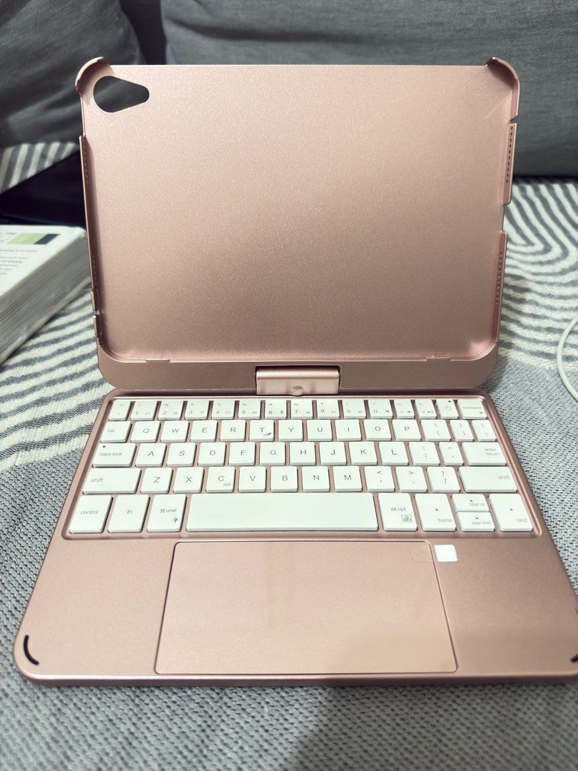 Ipad mini 7 keyboard (Category: Computer Keyboard) located in Santa Rosa. Submitted by pasabuy_by_angel (Listing ID 1405114264, Image 2). Description: - Rose gold keyboard case - Built-in keyboard and trackpad - Magnetic closure - Stand function - Decorated with stickers - Designed for tablets.