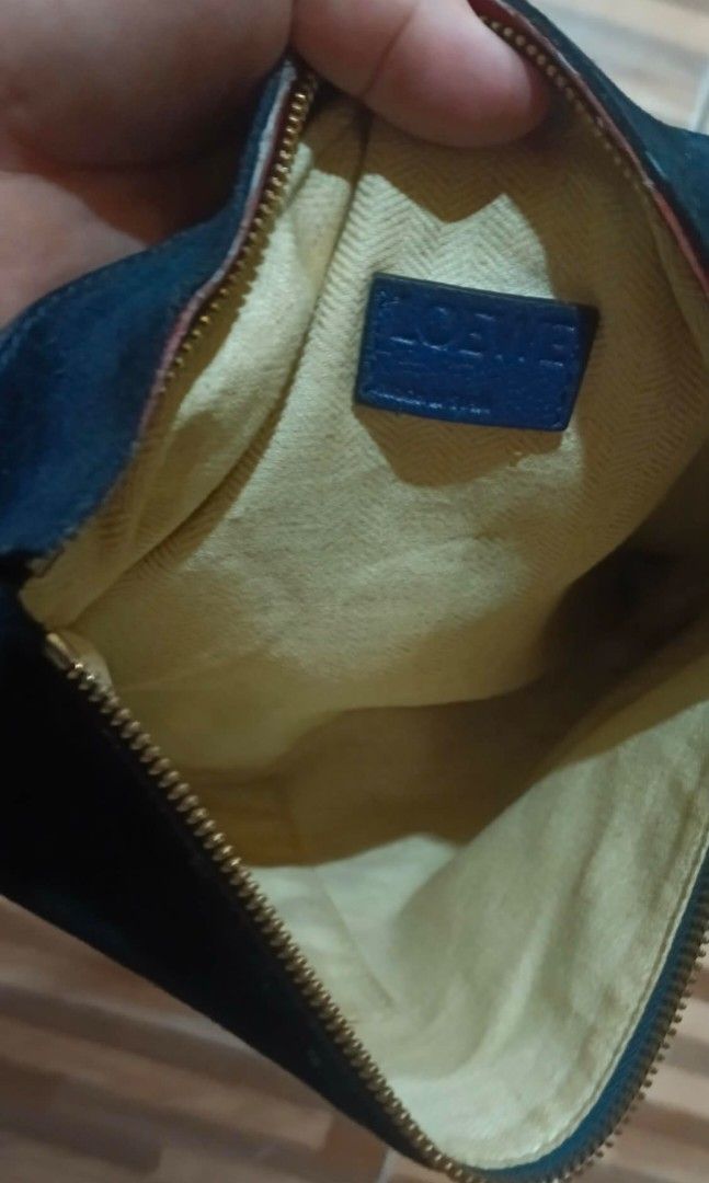 loewe pouch/clutch (Category: Luxury Bags & Wallets) located in Legazpi City. Submitted by georgepine07142 (Listing ID 1405150417, Image 2). Description: Preloved Loewe Pouch Clutch A stylish and functional piece designed to keep your essentials and accessories in one elegant pouch. Comes with its code and brand label inside. Shows signs of usage but still in good, usable condition. A chic Loewe classic perfect for everyday carry..