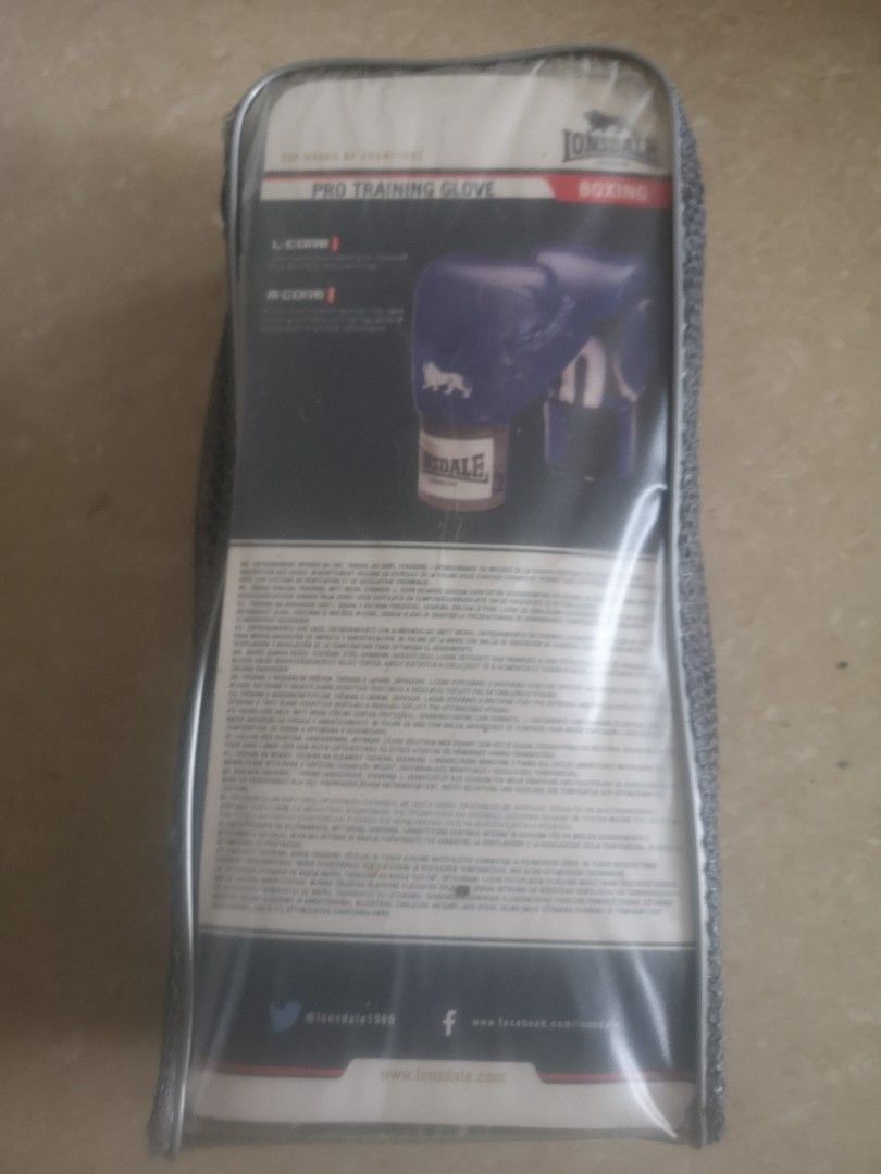 Lonsdale Pro Training Boxing Gloves 10oz (Category: Combat Sports) located in Muntinlupa City. Submitted by strlltsantos (Listing ID 1404989493, Image 3). Description: Lonsdale Pro Training boxing gloves. These blue gloves are designed for heavy bag training, mitt work, and sparring. The gloves are 10oz and come with a carrying case. The Lonsdale logo is visible on the gloves and the case..