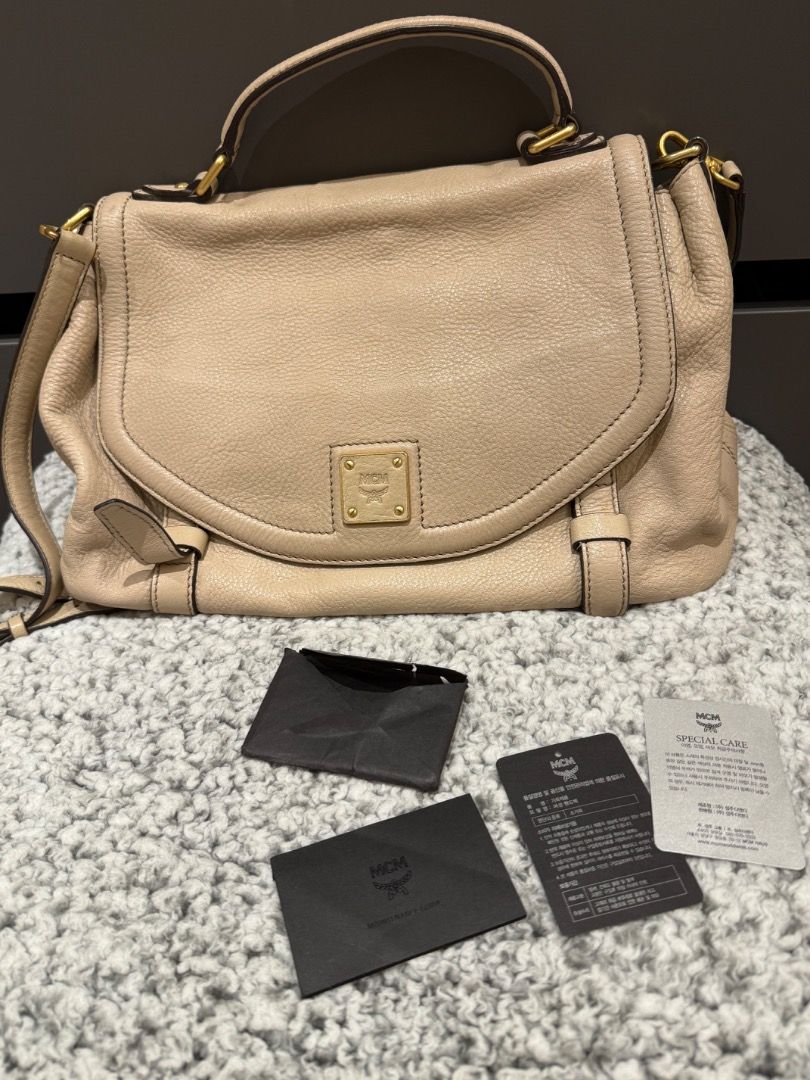 MCM two way Crossbody/hancarry bag (Category: Luxury Bags & Wallets) located in Cavite. Submitted by clandestine1907 (Listing ID 1404993173, Image 1). Description: Authentic MCM messenger bag/handcarry bag Leather beige RANK A With dustbag and care cards Issues: see last two photos.