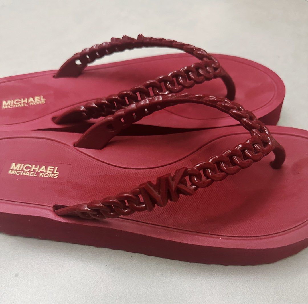 Michael Kors Zaza Platform Flip-flops in Deep Red (Category: Slippers and slides) located in Taguig. Submitted by deckluttering (Listing ID 1405067720, Image 3). Description: -used only once and indoors only -good condition 💯 -no box included when originally bought -originally bought for 5K at UK outlet - Chain MK detail on straps .
