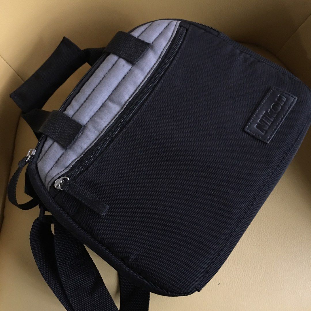 NIKON Hand and Shoulder Camera Bag (Category: Camera Bags & Carriers) located in Tarlac. Submitted by greatfindstrlc (Listing ID 1405124186, Image 3). Description: Black and Grey design, two zipper opening. Medium size camera bag, fits a DSLR Body and a stock Lens. Japan .