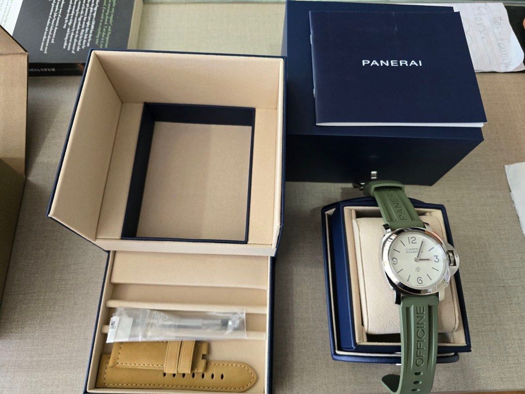 Panerai Luminor (Category: Luxury Watches) located in Manila. Submitted by act23 (Listing ID 1405045318, Image 2). Description: 2025 Panerai Complete PAM 1087 Base model Under Warranty till 2033 Local Purchased last june Unused extra strap - Panerai Luminor - White dial - Green strap (plus beige strap) - Includes original box and papers - Presented in original packaging - Distinctive design with clear numerals - Robust appearance .