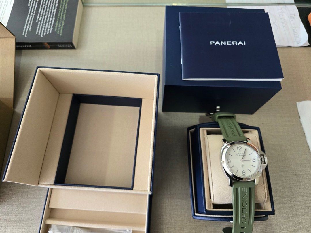 Panerai Luminor (Category: Luxury Watches) located in Manila. Submitted by act23 (Listing ID 1405045318, Image 3). Description: 2025 Panerai Complete PAM 1087 Base model Under Warranty till 2033 Local Purchased last june Unused extra strap - Panerai Luminor - White dial - Green strap (plus beige strap) - Includes original box and papers - Presented in original packaging - Distinctive design with clear numerals - Robust appearance .
