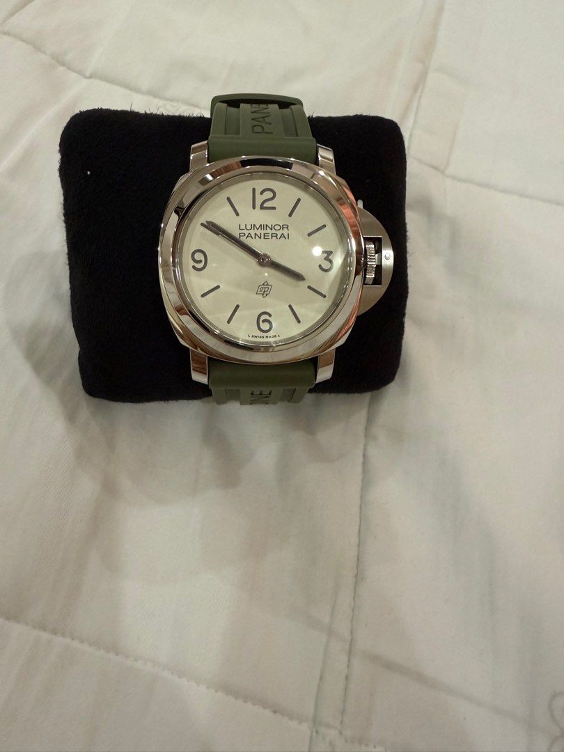 Panerai Luminor (Category: Luxury Watches) located in Manila. Submitted by act23 (Listing ID 1405045318, Image 1). Description: 2025 Panerai Complete PAM 1087 Base model Under Warranty till 2033 Local Purchased last june Unused extra strap - Panerai Luminor - White dial - Green strap (plus beige strap) - Includes original box and papers - Presented in original packaging - Distinctive design with clear numerals - Robust appearance .