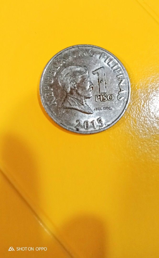 Philippine 1 Piso error coin 2015 (Category: Currency) located in Candon. Submitted by sniper_25 (Listing ID 1405100241, Image 2). Description: - Philippine 1 piso coin. - dated 2015 with excess metal on the number 1. - it is a coin with a reverse die III..