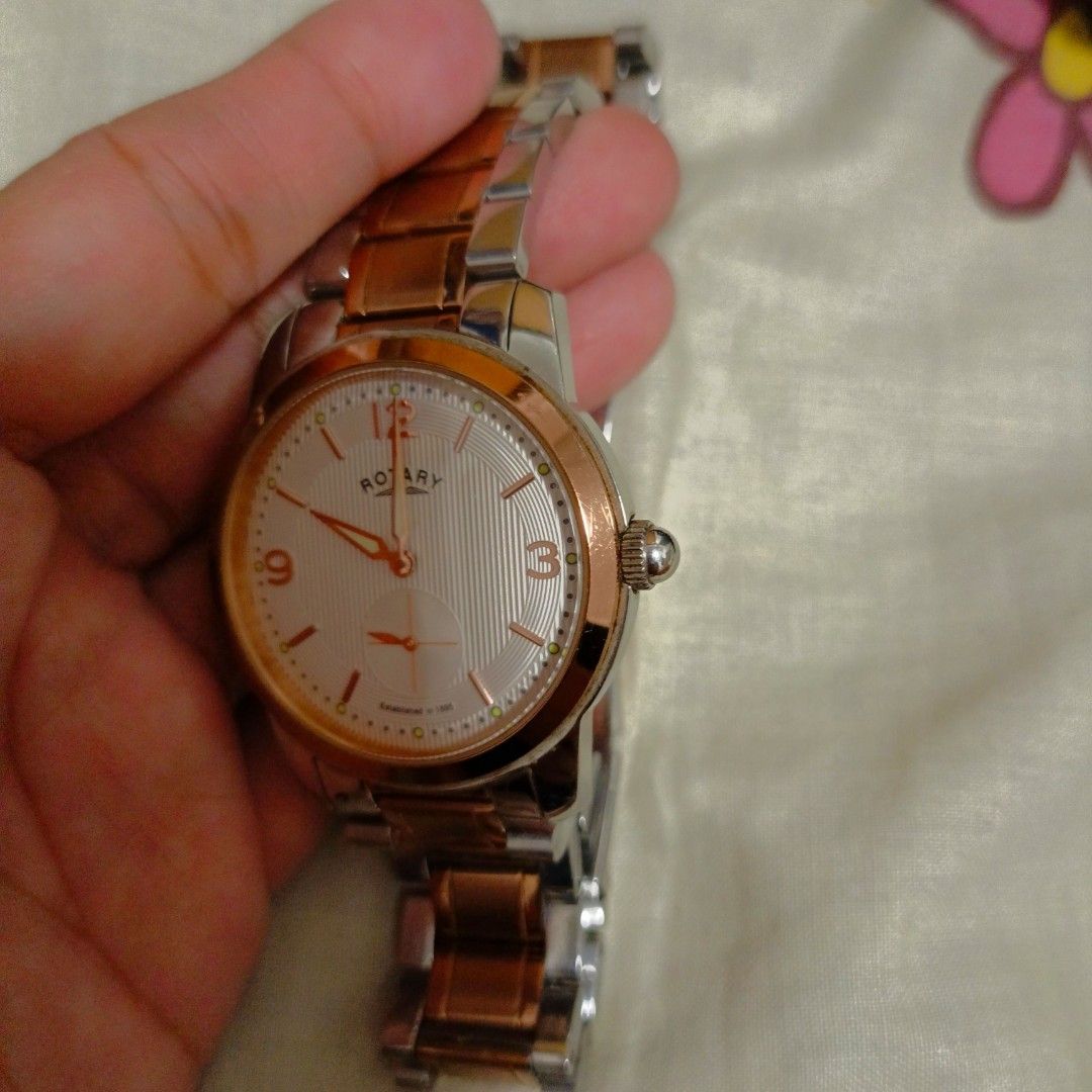 Rotary Stainless Steel Watch (Category: Men's Watches) located in Cainta. Submitted by samilaine (Listing ID 1405084507, Image 3). Description: - Rotary watch with silver dial and rose gold accents - Stainless steel two-tone band - Date display at 6 o'clock - Stainless steel back - A stylish accessory for everyday wear.