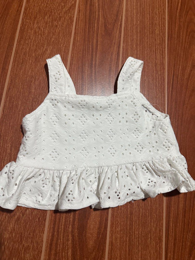 Shein White Eyelet Top and Shorts Set (Category: Babies & Kids Fashion) located in San Fernando. Submitted by donaborj (Listing ID 1405065259, Image 2). Description: - Shein eyelet top and shorts set - White color - Top: Square neckline, ruffled hem - Shorts: Matching eyelet design, tie waist - Size: 4Y - Ideal for summer wear.