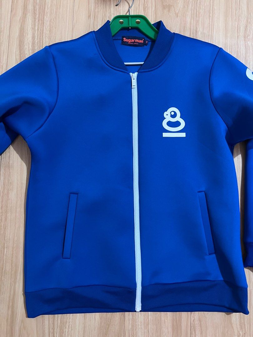Sugarman Blue Jacket (Category: Coats, Jackets and Outerwear) located in Marikina City. Submitted by declutteringcarly (Listing ID 1405048592, Image 1). Description: - Blue Sugarman bomber jacket - Sugarman logo on front and back - Two front pockets - Ribbed collar and cuffs -expensive brand from - last price -can fit up to large men .