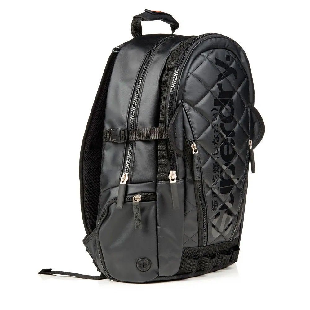 Superdry quilted Black Backpack authentic (Category: Backpacks) located in Manila. Submitted by welbern (Listing ID 1404994376, Image 2). Description: Minor scratches https://youtu.be/zo1DPgy9GIg?si=u45dYhibCb230IGL - Black Superdry backpack - Quilted front design - Multiple zippered compartments - Side pockets - Front pocket - Adjustable straps - Top handle - Superdry logo on front and back - Interior mesh pocket - Separate compartment.