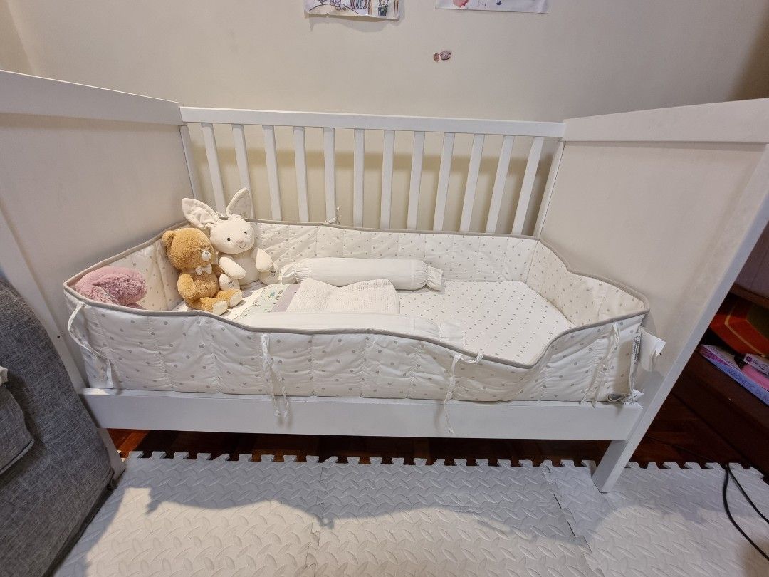 TAKE ALL IKEA White Baby Crib w/ Bedding Set (Category: Cots & Cribs) located in Quezon City. Submitted by rl_minimalist (Listing ID 1405100874, Image 2). Description: - White baby crib - Slatted side and solid end panels - Includes crib bumper and bedding - Convertible - Suitable for baby or toddler - Simple, clean design - Didnt use the crib and beddings Refer to other listings for details on crib and beddings.