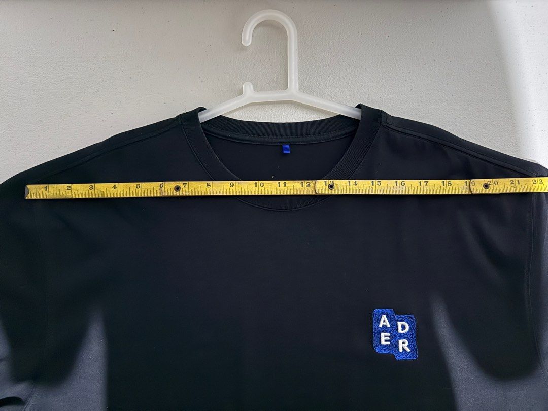 Ader Error T-shirt (Category: Tshirts & Polo Shirts ) located in Bulacan. Submitted by streethrifter (Listing ID 1401877125, Image 3). Description: 👕Item Name: Ader Error Mini Logo-Embroidered Patch T-Shirt 📏 Size (Flat Lay Measurements): • Width: 22 inches • Length: 29 inches • Sleeve Length: 11 inches • Sleeve Opening: 8.5 inches 🎨 Color: Black — 10/10 color rate (crisp and rich black) ✨ Condition: Excellent — no flaws, minimal signs of wear