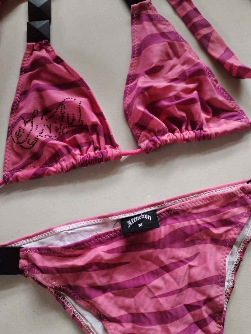 [sold] Affliction Sinful Pink Zebra Print Bikini Set (Category: Bikinis & Swimsuits) located in Cebu City. Submitted by crispyfri3dchicken (Listing ID 1401796717, Image 3). Description: - Pink zebra print bikini set - Triangle top with studded accents - Adjustable straps for a comfortable fit - Matching bottom with black waist accent - Size: M.