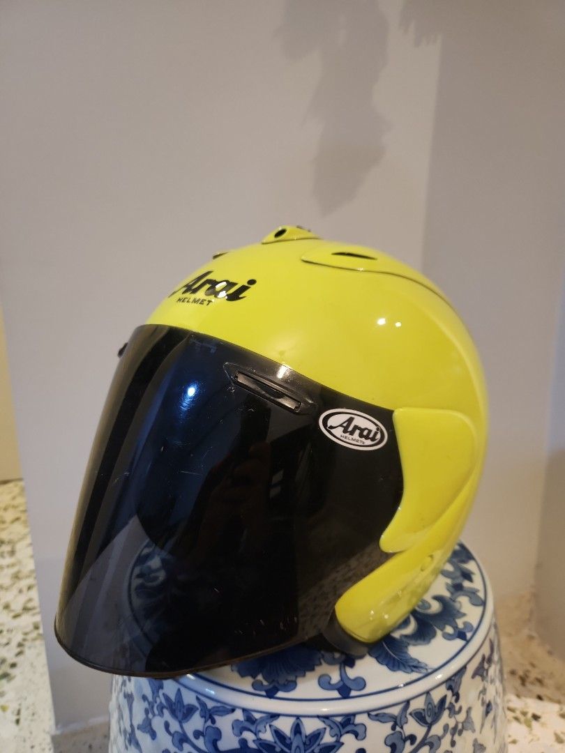 Arai Ram 1 helmet (Category: Motorcycle Accessories) located in Singapore. Submitted by wasupmersibles (Listing ID 1401798677, Image 1). Description: Arai Ram 1. Repainted to floro yellow (New). New headliner. Storage marks only. Size M. .
