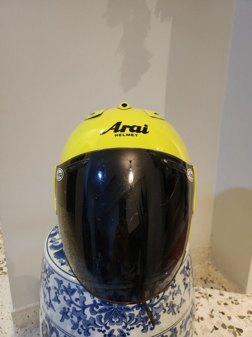 Arai Ram 1 helmet (Category: Motorcycle Accessories) located in Singapore. Submitted by wasupmersibles (Listing ID 1401798677, Image 2). Description: Arai Ram 1. Repainted to floro yellow (New). New headliner. Storage marks only. Size M. .