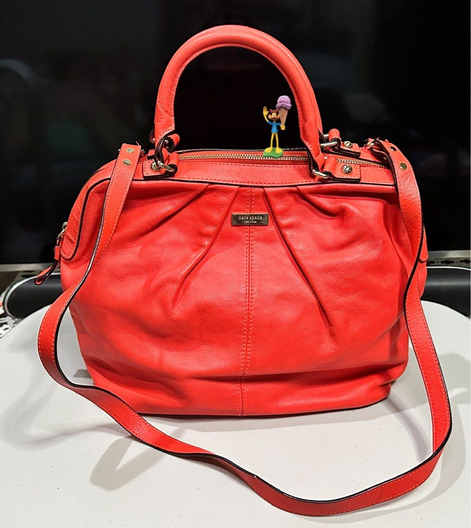 Authentic Kate Spade Handbag (Category: Luxury Bags & Wallets) located in Manila. Submitted by krishywishy (Listing ID 1401735356, Image 2). Description: Authentic Kate Spade handbag in a vibrant coral color. Features a top handle and a detachable shoulder strap. Includes a dust bag for storage. A stylish and functional accessory for any occasion..