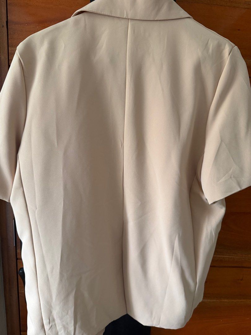 Beige Short Sleeve Blazer (Category: Coats, Jackets and Outerwear) located in Paranaque City. Submitted by krishamel (Listing ID 1401723159, Image 3). Description: - Classic lapel collar - Two front pockets - Two-button closure - Minor fabric imperfections - see photos for issues.