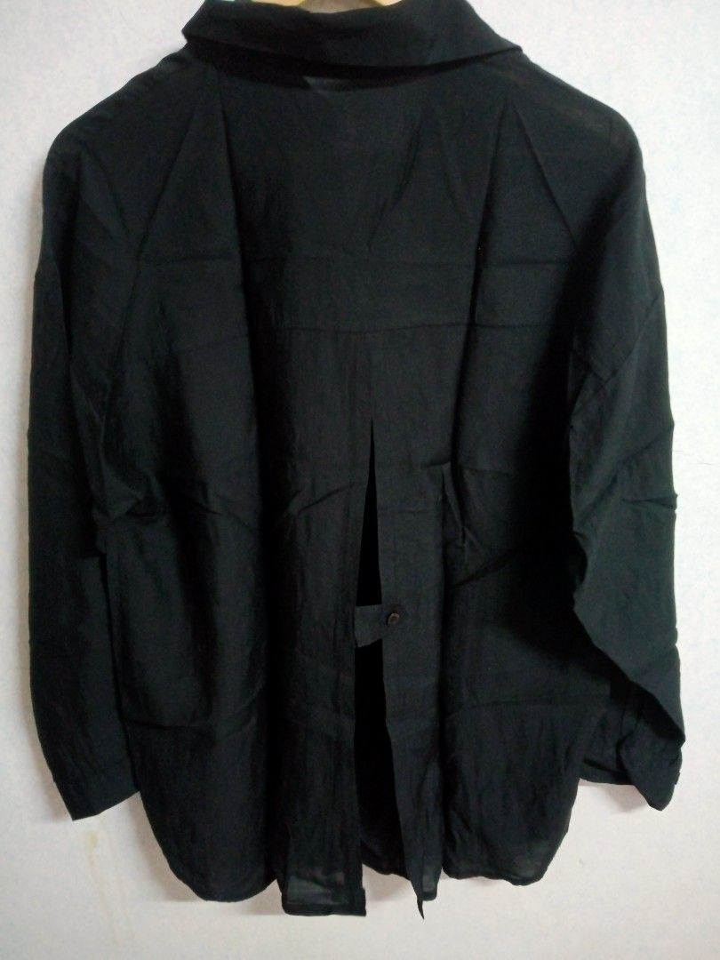 Black Button-Down Blouse (Category: Blouses) located in Bulacan. Submitted by ely46 (Listing ID 1401846114, Image 2). Description: - Black button-down blouse - Brand: ANITA - Collared neckline - Long sleeves - Unique split back design with button closure - Lightweight fabric.