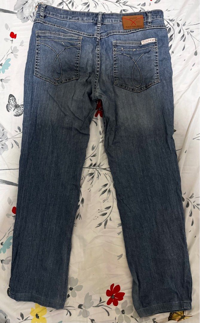 Calvin Klein Jeans W34 L34 (Category: Jeans) located in Baguio. Submitted by arkay_13 (Listing ID 1401896019, Image 2). Description: Authentic Calvin Klein Jeans in a classic blue wash. Features a straight leg fit. Size W34 L34. Made from a blend of cotton and elastane. The jeans have a button closure and classic five-pocket design. There is a small stain on the front of the jeans. See the tag for details..