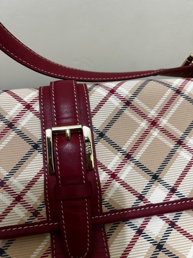 DÅĶŚ Shoulder Bag with Plaid Pattern (Category: Shoulder Bags) located in Quezon City. Submitted by re.ed (Listing ID 1401855451, Image 3). Description: - Authentic Daks shoulder bag - Iconic plaid pattern (beige, red, white) - Secure flap closure with gold-tone buckle - Stylish red leather strap and trim - Interior zippered pocket - DÅĶŚ holo lining - LIKE NEW!!! .