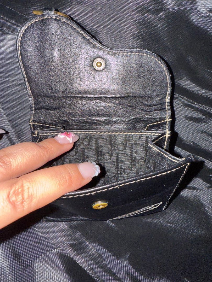 Dior Saddle short wallet (Category: Luxury Bags & Wallets) located in Bulacan. Submitted by f_bags (Listing ID 1401855427, Image 2). Description: Dior Saddle Short Wallet Good condition No rips on lining With Dior monogram lining With readable code as pictured Flaw as pictured: need rubber sealing on the flap .
