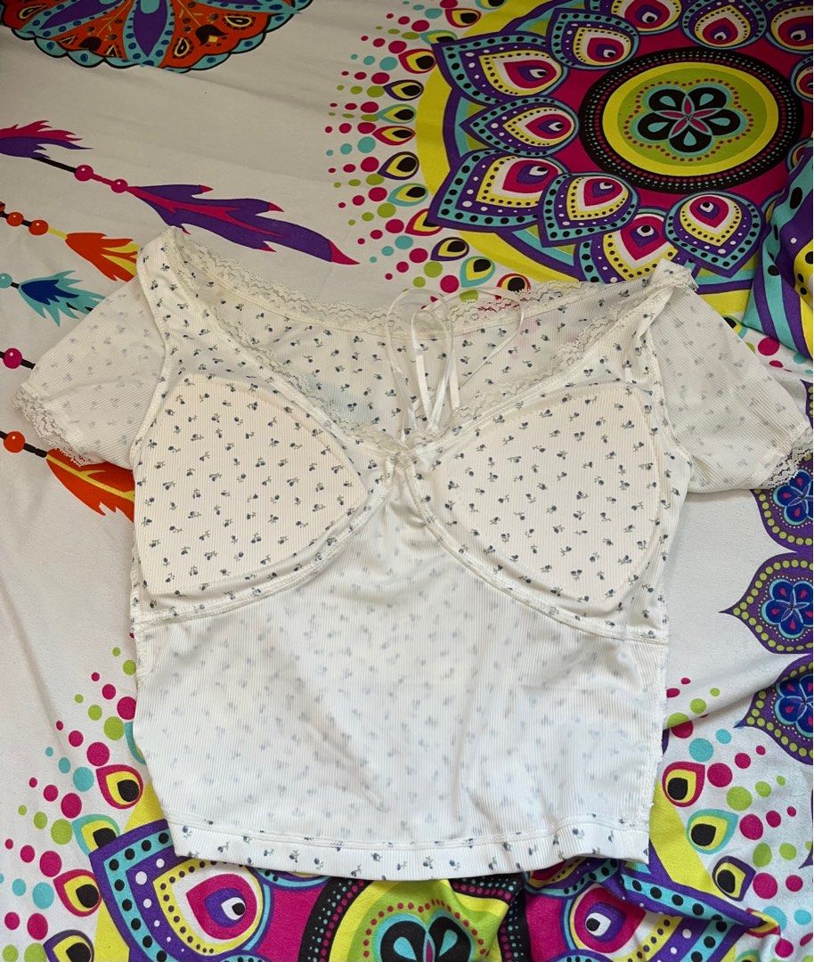 Floral Lace Trim Top (Category: Blouses) located in Paranaque City. Submitted by rieclutter (Listing ID 1401756898, Image 3). Description: - can fit xs-m - Floral patterned top - Lace trim detail - Tie detail at bust - Short sleeves - Scoop neckline - Ribbed fabric.