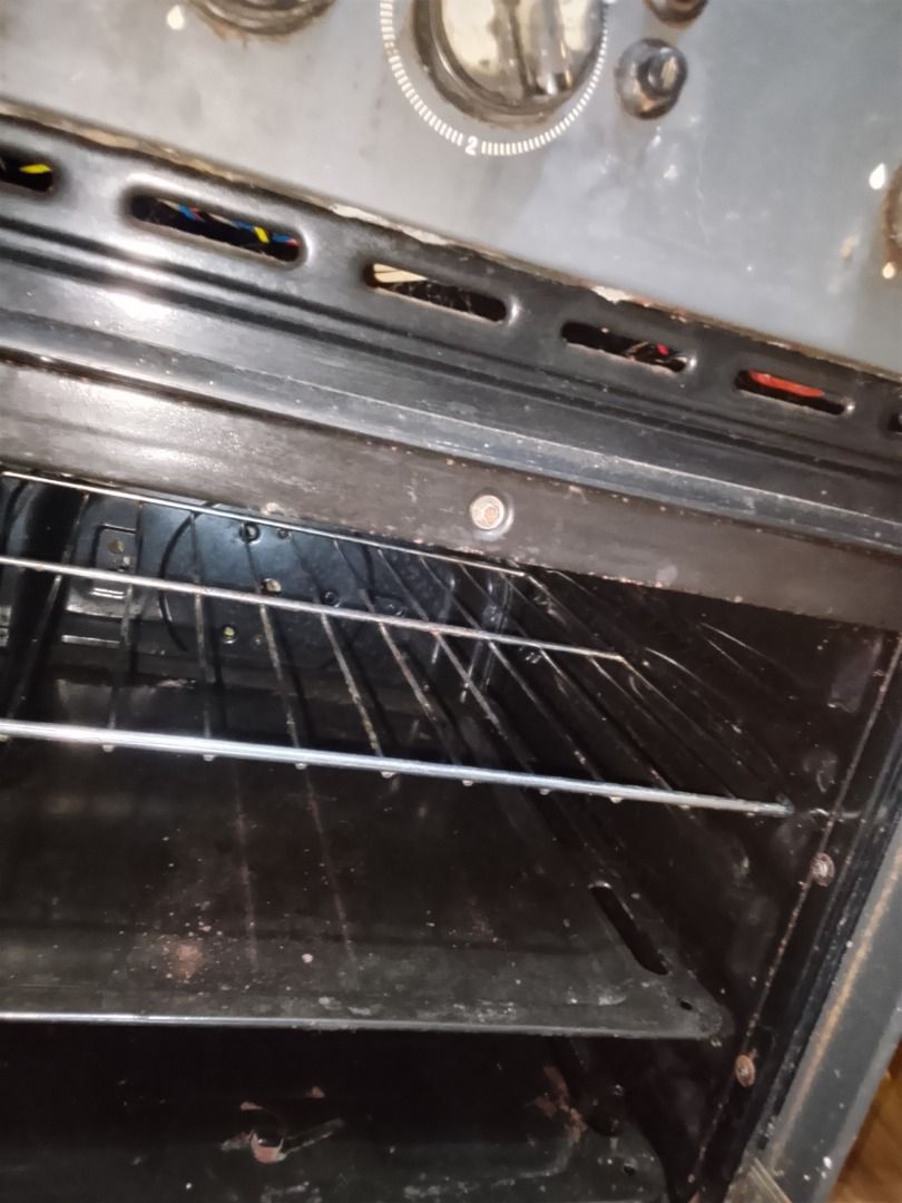 Gas Range with Oven (Category: Ovens & Toasters) located in Quezon City. Submitted by albertoferryanne50 (Listing ID 1401910353, Image 2). Description: gas range with four burners and an oven. Features control knobs for burner and oven temperature adjustments. Includes oven racks. The exterior is a combination of silver and black. has electric coil for back up if maubos ang gasul.. will transfer to a smaller place kaya selling.
