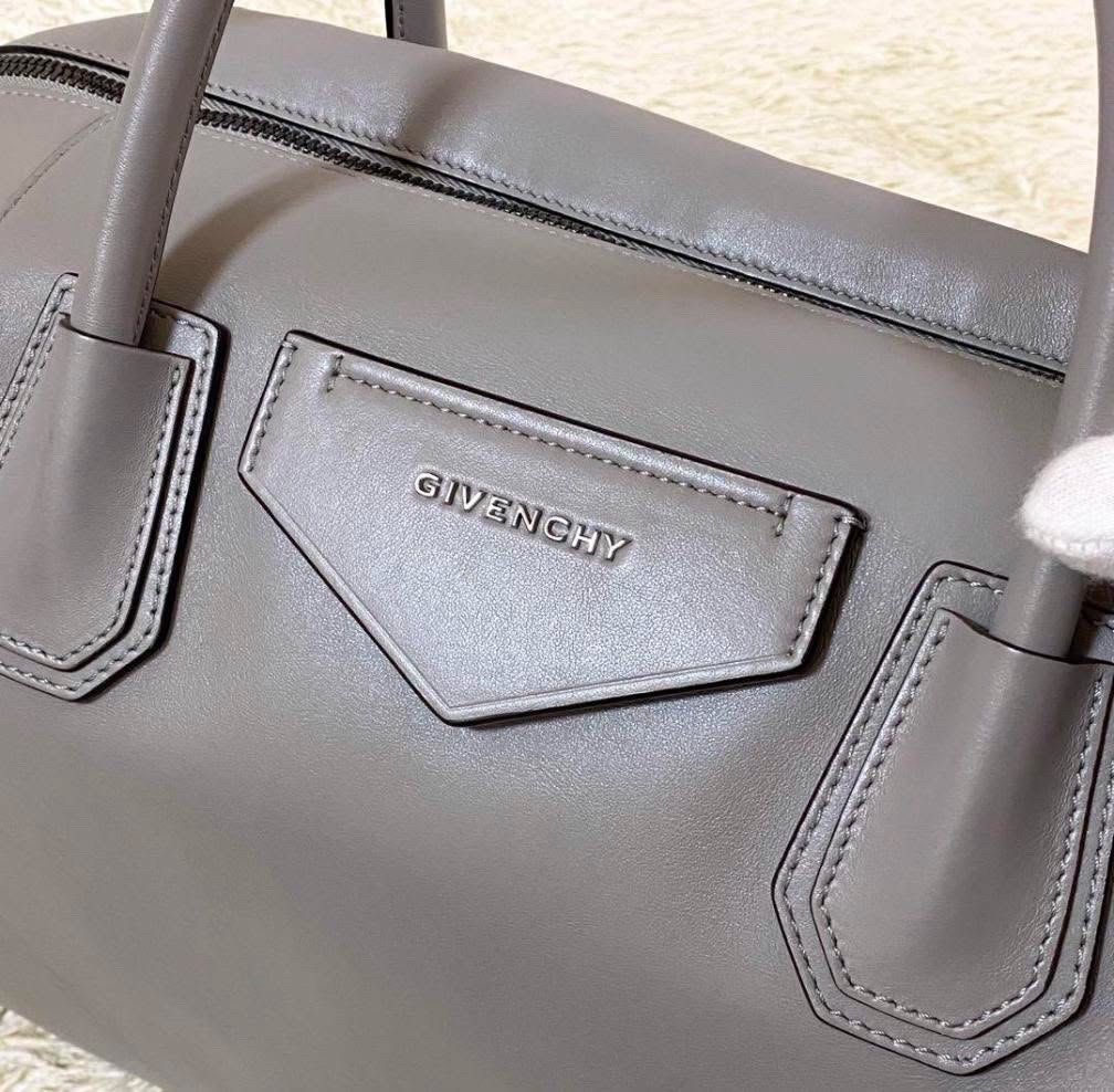 Givenchy Antigona Soft Medium Grey Handbag (Category: Luxury Bags & Wallets) located in Makati City. Submitted by shopauthenticdesigner (Listing ID 1401718506, Image 3). Description: - Authentic Givenchy Antigona handbag - Elegant grey color - Top handle and detachable shoulder strap - Features front logo detail - Spacious interior - Includes dust bag - Perfect for any occasion Strap Length: 55cm / 21.5” Handle Drop: 10cm / 3.9” Height: 41cm / 16