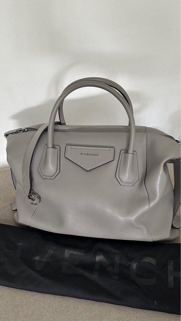 Givenchy Antigona Soft Medium Grey Handbag (Category: Luxury Bags & Wallets) located in Makati City. Submitted by shopauthenticdesigner (Listing ID 1401718506, Image 1). Description: - Authentic Givenchy Antigona handbag - Elegant grey color - Top handle and detachable shoulder strap - Features front logo detail - Spacious interior - Includes dust bag - Perfect for any occasion Strap Length: 55cm / 21.5” Handle Drop: 10cm / 3.9” Height: 41cm / 16