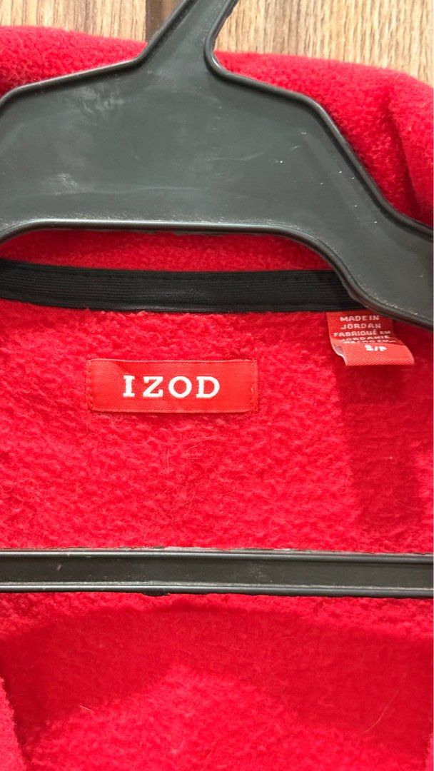 IZOD Red Fleece Vest (Category: Vests) located in Taguig. Submitted by rizacarza (Listing ID 1401897739, Image 3). Description: IZOD vest is a vibrant red color. It features a full zipper closure and a black trim along the collar and armholes. The IZOD logo is visible on the chest. The vest is made in Jordan. It has a size S/P..