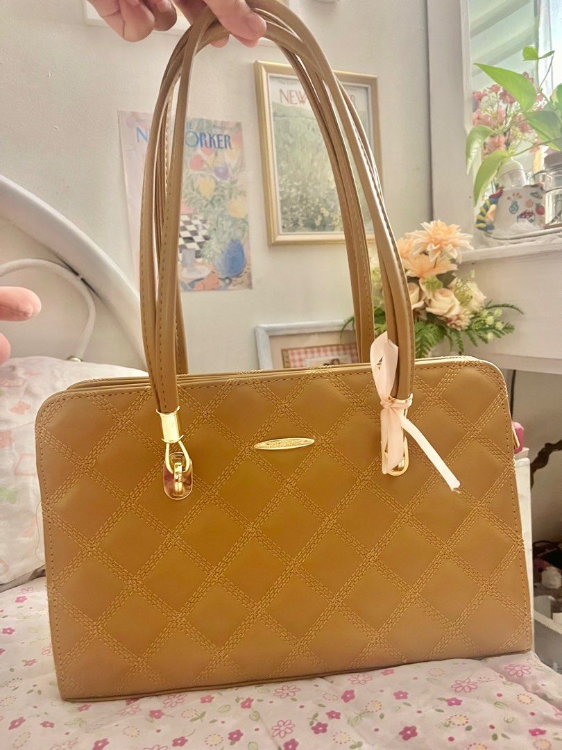 Jovanni Quilted Handbag (Category: Luxury Bags & Wallets) located in Manila. Submitted by revdeclutter (Listing ID 1401877795, Image 2). Description: Tan Jovanni handbag with quilted design. Features double handles and gold hardware. Includes tag. Rectangular shape. .