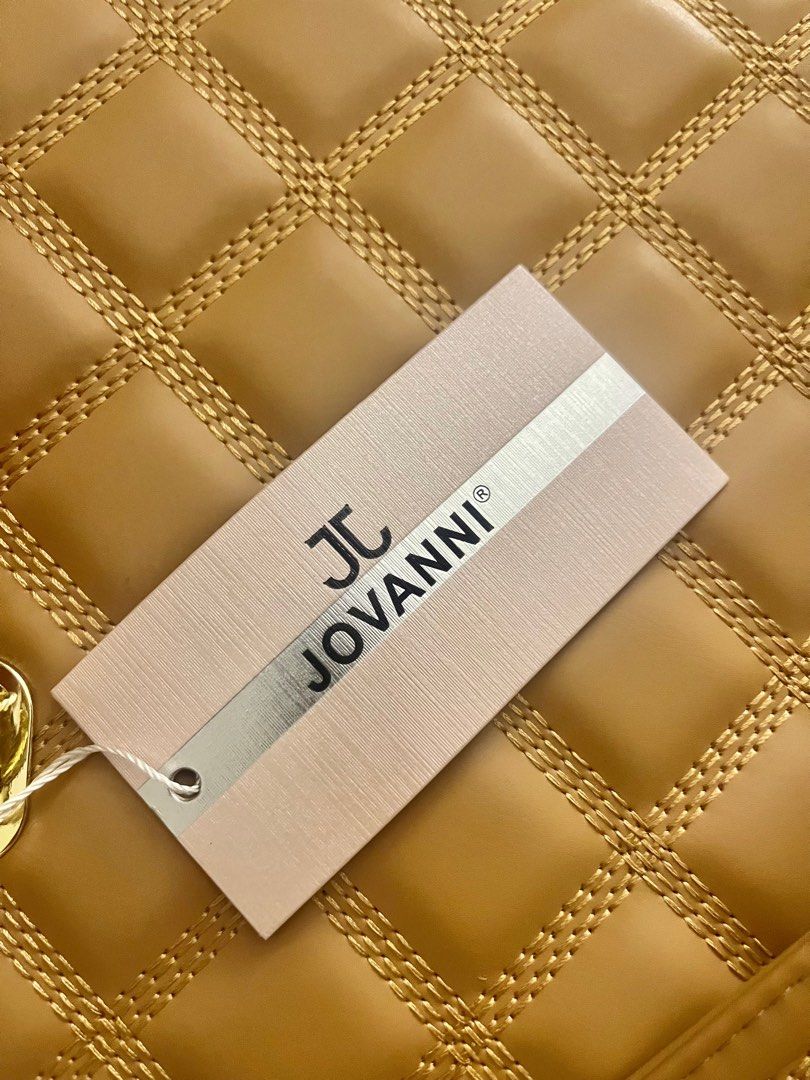 Jovanni Quilted Handbag (Category: Luxury Bags & Wallets) located in Manila. Submitted by revdeclutter (Listing ID 1401877795, Image 3). Description: Tan Jovanni handbag with quilted design. Features double handles and gold hardware. Includes tag. Rectangular shape. .