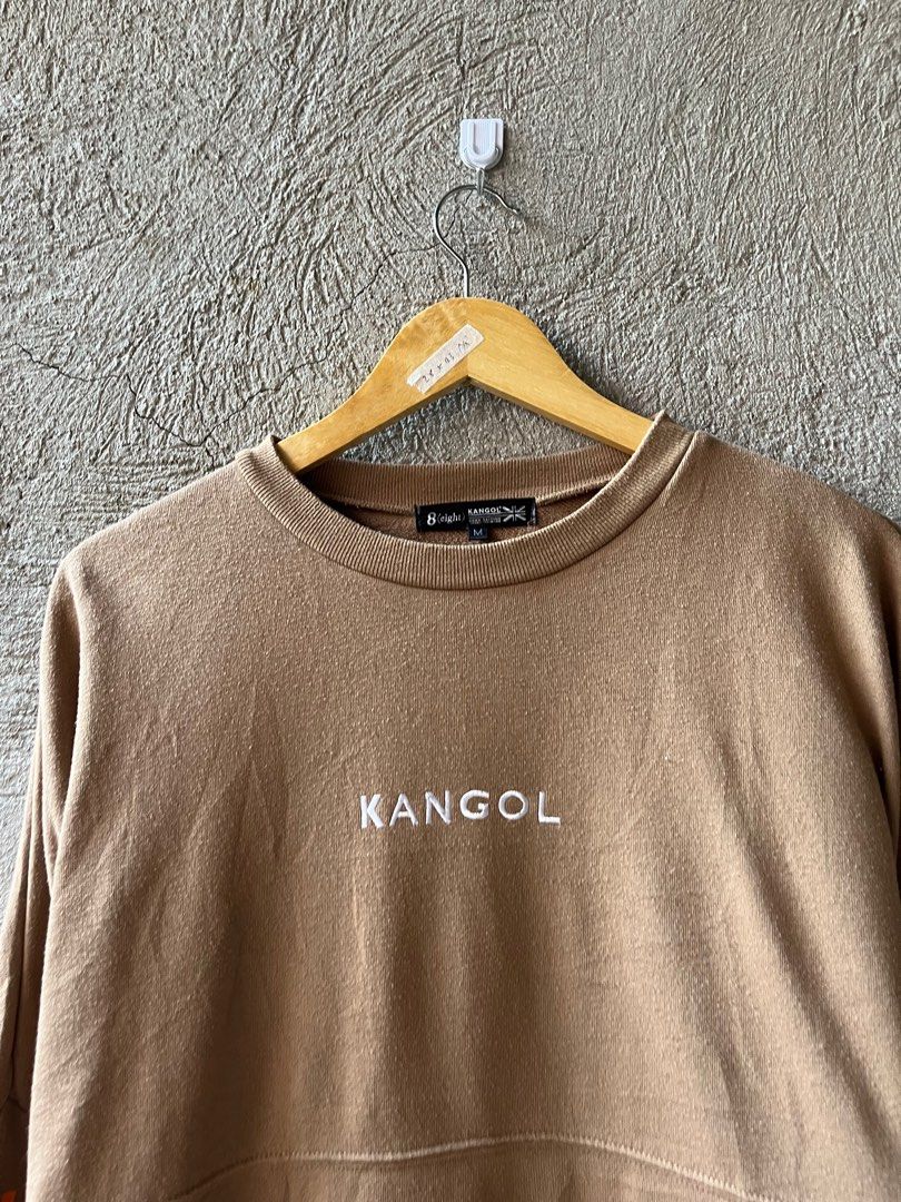 Kangol Sweatshirt - Brown - Size M (Category: Coats, Jackets and Outerwear) located in Famy. Submitted by basicthrifted (Listing ID 1401845515, Image 3). Description: - Kangol Sweatshirt - Brown color - Size M - Features Kangol logo - Unique sleeve design.