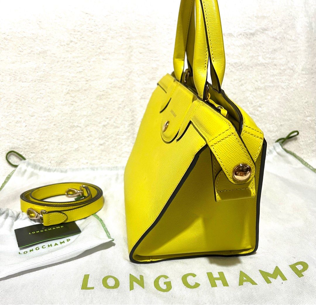Longchamp Le Pliage Heritage Tote Leather Handbag (Category: Luxury Bags & Wallets) located in Quezon City. Submitted by thefringe (Listing ID 1401846719, Image 3). Description: Price is negotiable. Guaranteed authentic. Bought it around 50k at Rustan’s. Complete with dust bags (bag and strap), care card and strap..