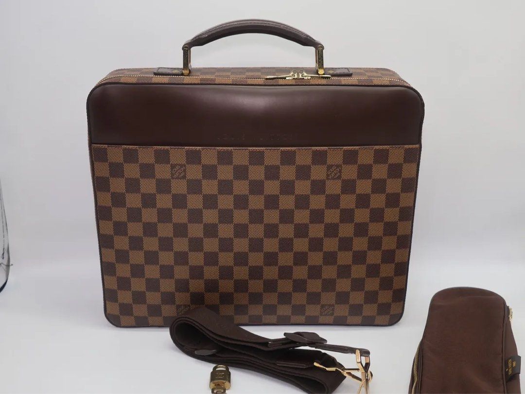 Louis Vuitton Damier Ebene Briefcase Sabana (Category: Luxury Bags & Wallets) located in Taguig. Submitted by vbvibares1 (Listing ID 1401839171, Image 1). Description: - Authentic Louis Vuitton Damier Ebene briefcase - Classic Damier Ebene brown checkered pattern - Top handle and detachable shoulder strap - Includes lock and keys, strap and dustbag - Secure zipper closure - Elegant gold-tone hardware.