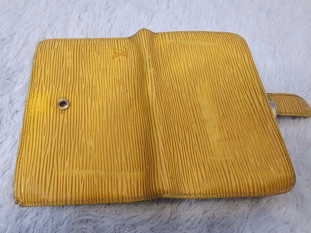 Authentic Louis Vuitton Epi Leather Wallet (Category: Luxury Bags & Wallets) located in Bulacan. Submitted by dgritzy (Listing ID 1401904798, Image 1). Description: ❗️❗️❗️❗️Christmas Sale❗️❗️❗️❗️ - Authentic Louis Vuitton Epi Leather wallet - Exterior: Yellow - Interior: Purple - Features: - Coin compartment - Multiple card slots - Closure: Snap and clasp - Made in France .