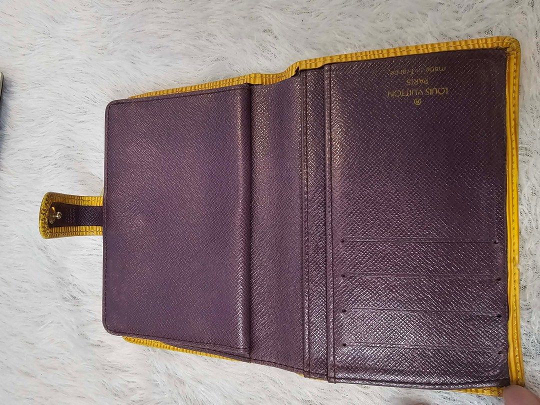 Authentic Louis Vuitton Epi Leather Wallet (Category: Luxury Bags & Wallets) located in Bulacan. Submitted by dgritzy (Listing ID 1401904798, Image 2). Description: ❗️❗️❗️❗️Christmas Sale❗️❗️❗️❗️ - Authentic Louis Vuitton Epi Leather wallet - Exterior: Yellow - Interior: Purple - Features: - Coin compartment - Multiple card slots - Closure: Snap and clasp - Made in France .