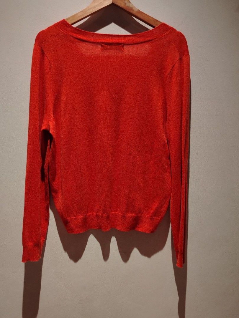 MNG V-Neck Sweater (Category: Coats, Jackets and Outerwear) located in Pasig City. Submitted by vthing (Listing ID 1401864028, Image 3). Description: - MNG bright red V-neck sweater - Size: S - Features: V-neck, long sleeves, ribbed hem and cuffs - Made in China - Versatile for layering.