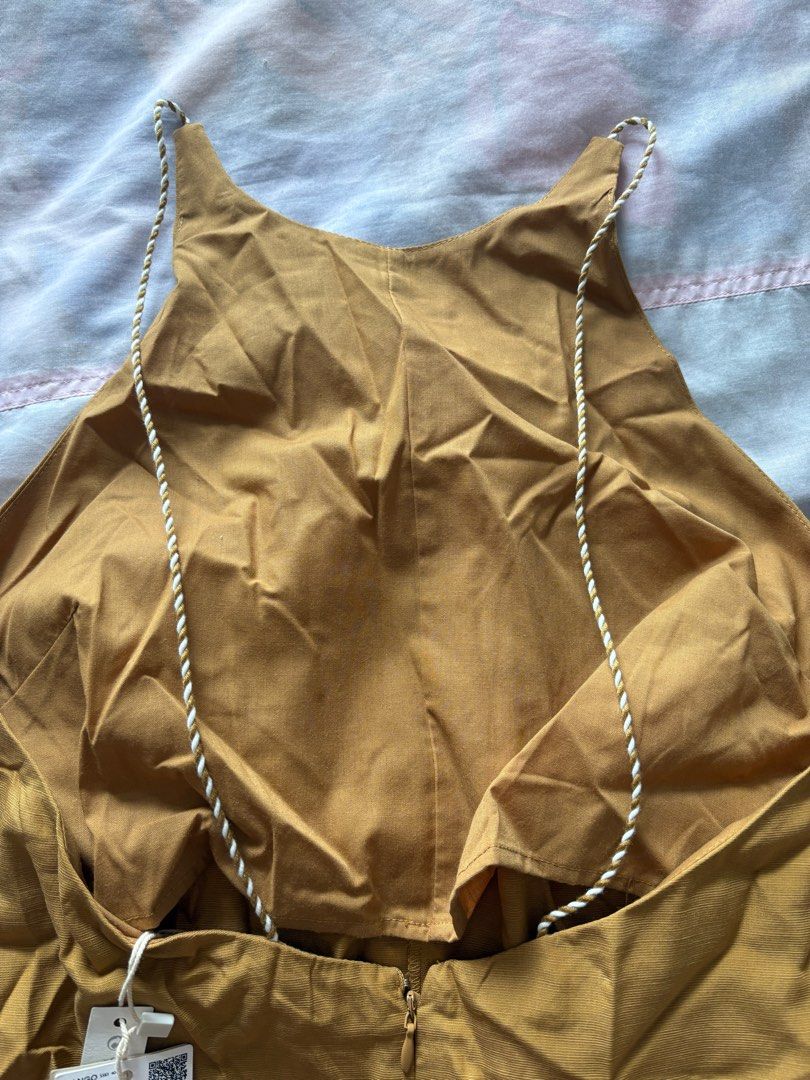 Mustard Yellow Halter Jumpsuit (Category: Jumpsuits) located in Quezon City. Submitted by malassezia (Listing ID 1401736428, Image 3). Description: - Mustard yellow halter jumpsuit - Wide-leg design - Back zipper closure - Delicate rope-like straps - Lightweight fabric - Perfect for warm weather - One-piece outfit.