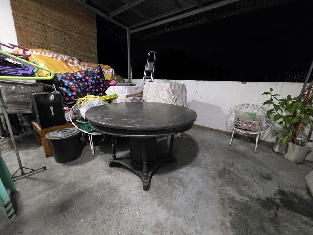 Narra Round Dining Table (Category: Tables & Sets) located in Valenzuela. Submitted by cmsitravels (Listing ID 1401868429, Image 3). Description: Dark wood dining table. Round shape, pedestal base. Sturdy and decorative..