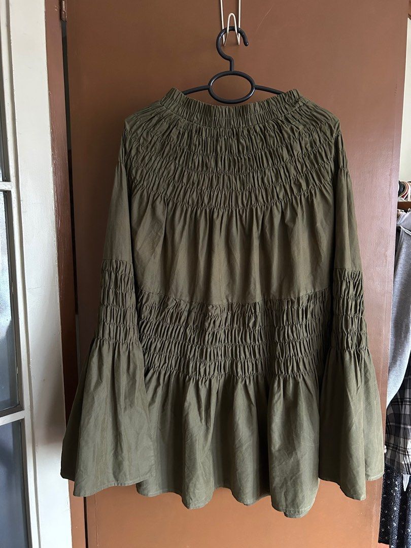 Olive Green Smocked Maxi Skirt (Category: Skirts) located in Manila. Submitted by anothermanxtreasure (Listing ID 1401822701, Image 1). Description: Suede like fabric, a nice deep autumnal color Fits XS-Semi Medium (stretchy but fit won’t be loose) Giving Copenhagen girlie with a high neck coat.