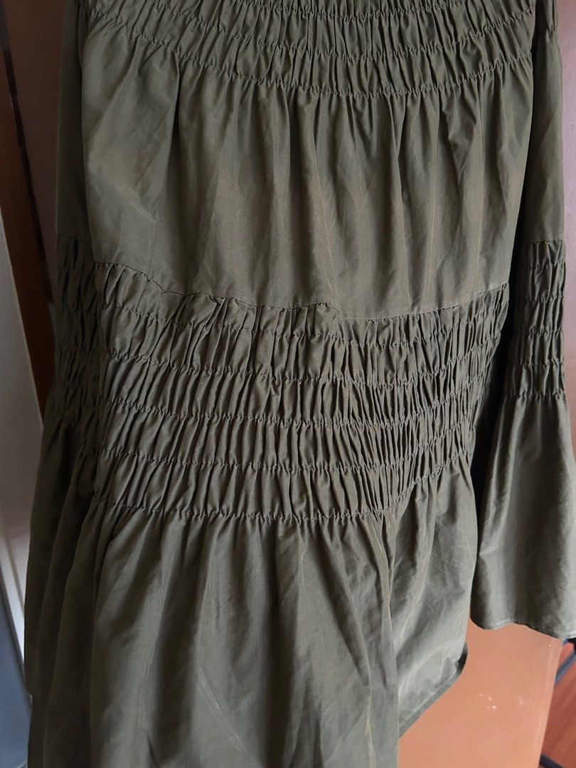Olive Green Smocked Maxi Skirt (Category: Skirts) located in Manila. Submitted by anothermanxtreasure (Listing ID 1401822701, Image 3). Description: Suede like fabric, a nice deep autumnal color Fits XS-Semi Medium (stretchy but fit won’t be loose) Giving Copenhagen girlie with a high neck coat.
