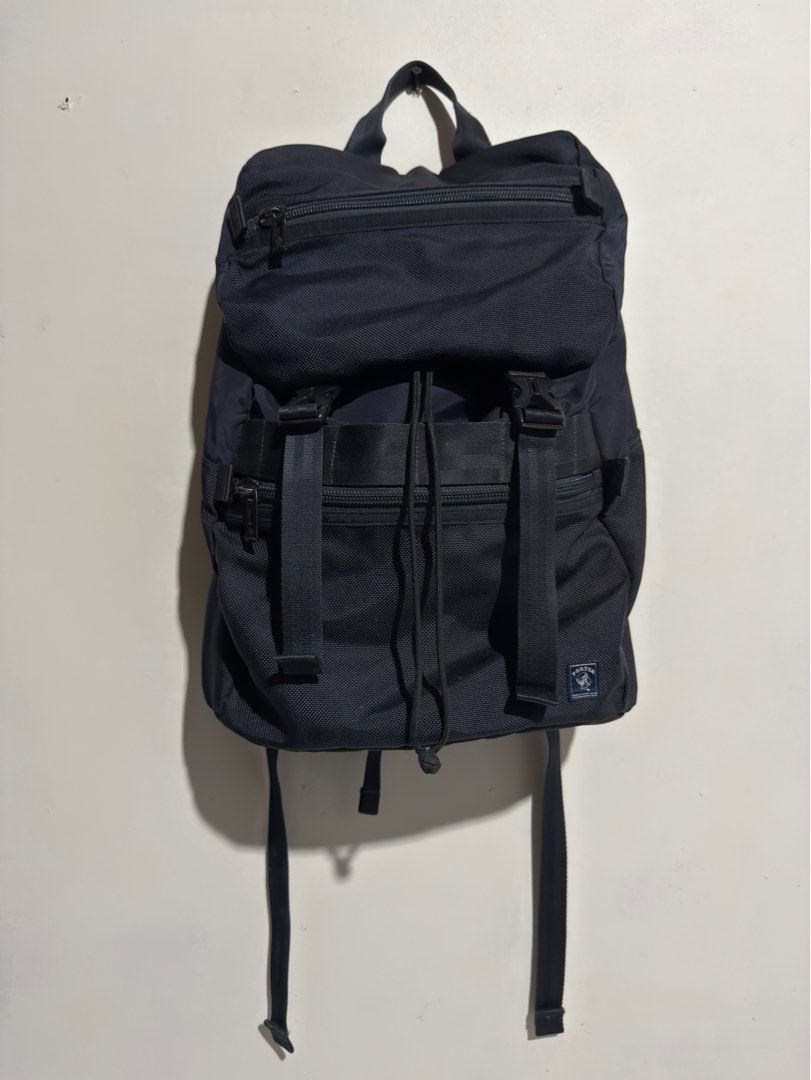 PORTER Klunkerz Daypack (Rucksack Backpack) (Category: Backpacks) located in Bulacan. Submitted by streethrifter (Listing ID 1401787755, Image 1). Description: 🎒 PORTER Klunkerz Daypack (Rucksack Backpack) 📏 Size: • Length: 17 inches • Width: 13 inches • Expandable: Up to 1–5.5 inches ✨ Condition: • Rating: 9/10 (Excellent overall) • Color: Dark bluish tone — rich and clean • Minor flaw: Slight fading on hardware only • No scratches — looks lik