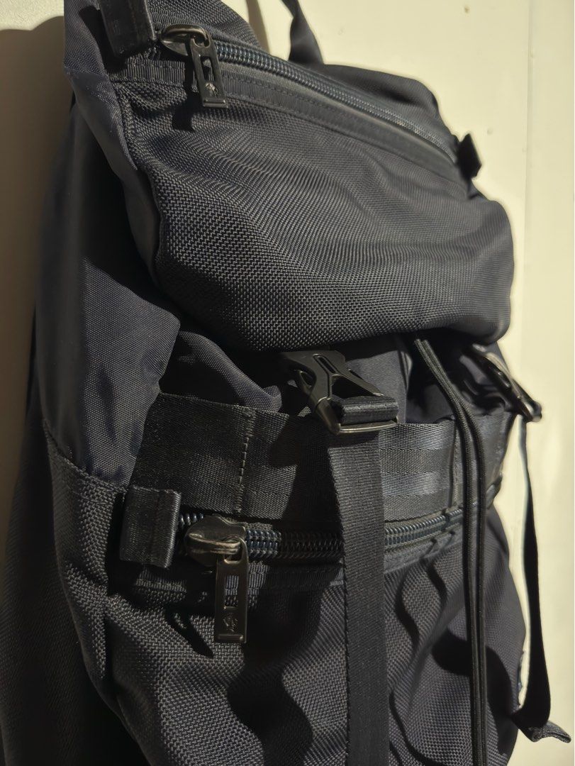 PORTER Klunkerz Daypack (Rucksack Backpack) (Category: Backpacks) located in Bulacan. Submitted by streethrifter (Listing ID 1401787755, Image 3). Description: 🎒 PORTER Klunkerz Daypack (Rucksack Backpack) 📏 Size: • Length: 17 inches • Width: 13 inches • Expandable: Up to 1–5.5 inches ✨ Condition: • Rating: 9/10 (Excellent overall) • Color: Dark bluish tone — rich and clean • Minor flaw: Slight fading on hardware only • No scratches — looks lik