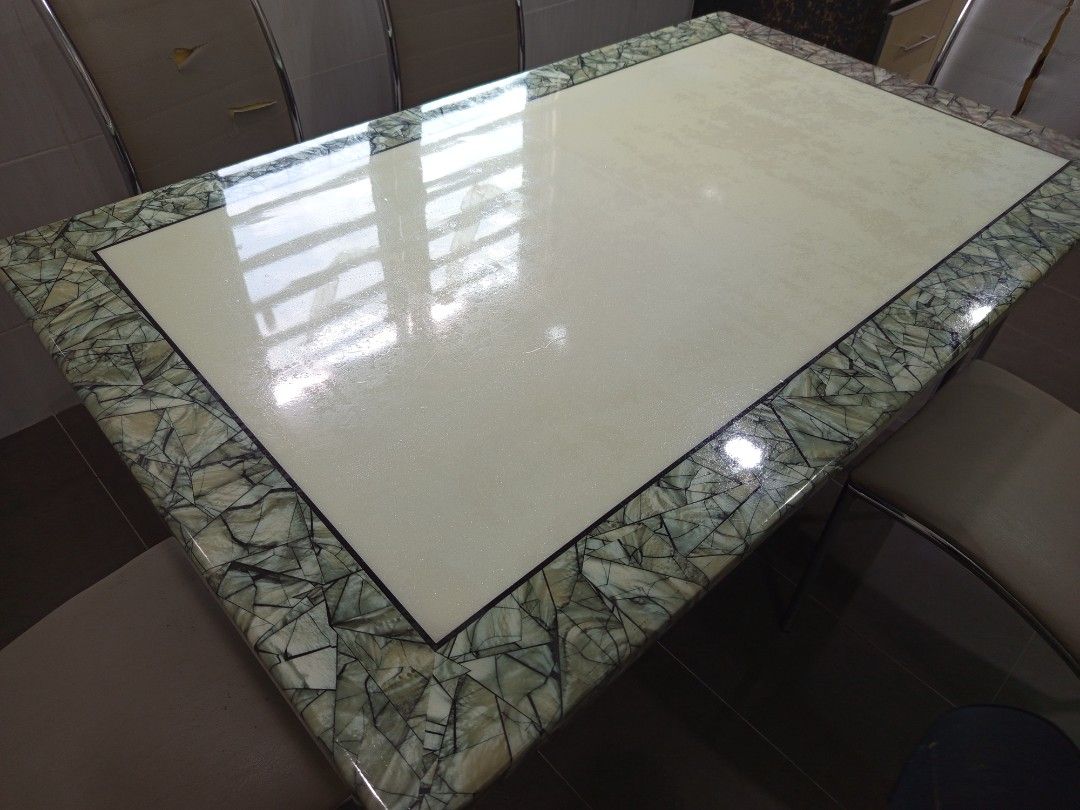 Rectangular Dining Table with Stone Border (Category: Tables & Sets) located in Seremban. Submitted by Avee1 (Listing ID 1401790390, Image 3). Description: - Rectangular dining table - Cream-colored center - Decorative stone border - Glossy finish - Modern design - Sturdy and stylish.