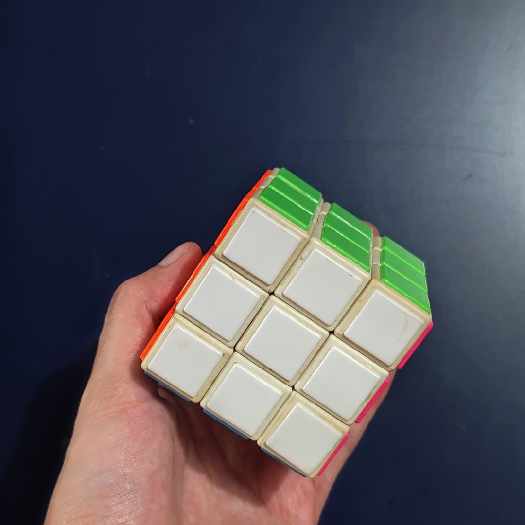 Rubik's Cube (Category: Board Games & Puzzles) located in Davao. Submitted by jz1988 (Listing ID 1401776703, Image 2). Description: - Classic 3x3 Rubik's Cube - Colorful squares - In good working condition - Great brain teaser for all ages - Challenges problem-solving skills.