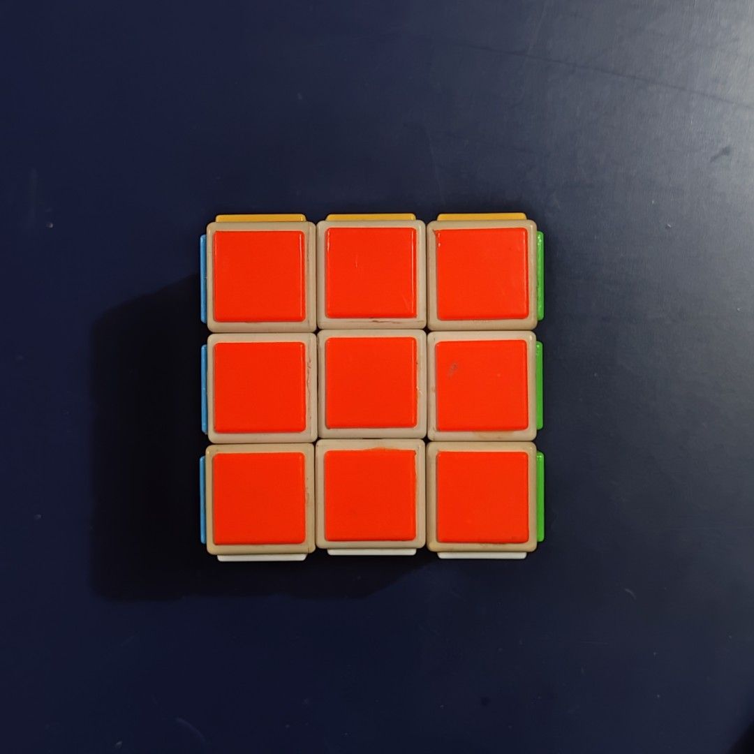 Rubik's Cube (Category: Board Games & Puzzles) located in Davao. Submitted by jz1988 (Listing ID 1401776703, Image 1). Description: - Classic 3x3 Rubik's Cube - Colorful squares - In good working condition - Great brain teaser for all ages - Challenges problem-solving skills.