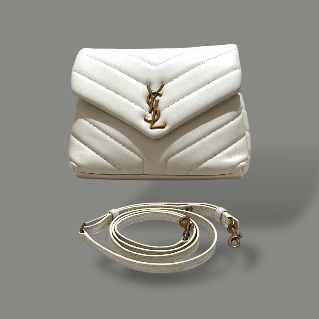 Saint Laurent Loulou Puffer Small Bag (Category: Luxury Bags & Wallets) located in Paranaque City. Submitted by kavionlineshop (Listing ID 1401853688, Image 1). Description: •Authenticity not guaranteed •Preloved •condition-7/10 - Saint Laurent Loulou Puffer Small Bag - White quilted design - Iconic YSL logo - Detachable shoulder strap - Chevron pattern.